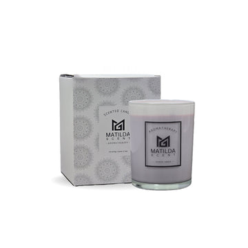 Candle with packaging featuring 'Matilda & Co' branding on a white background