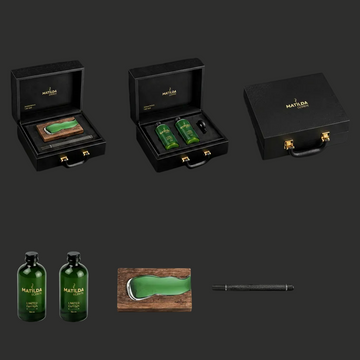 Collection of Matilda brand products including green bottles, a wooden tray, and a black box on a black background.
