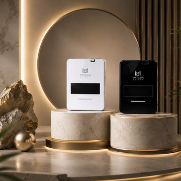 Two devices, one white and one black, on stone bases with a decorative background.